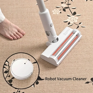 New Chinese style beige carpet with floral pattern being cleaned by a vacuum nozzle