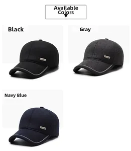 Close-up of baseball caps in black, grey, and navy colors with small Fashion labels