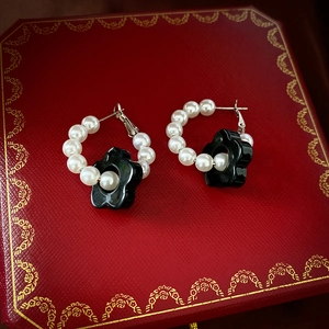 Retro acrylic pearl flower earrings with gold hoop and black floral pendant on red box