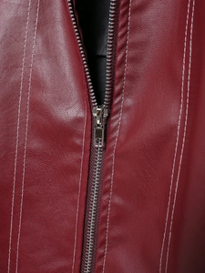 Detail of dark red leather jacket featuring silver metal zipper and white contrast stitching