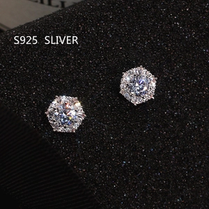 Macro shot of S925 silver hexagonal stud earrings with brilliant zircon stones