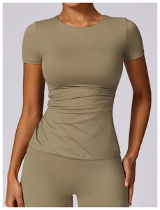 Detailed close-up of slim-fit yoga t-shirt in olive green with high-stretch fabric texture