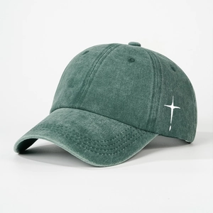 Deep green washed cotton baseball cap with white cross embroidery and curved brim