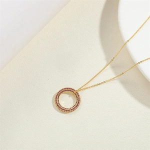 14K gold plated necklace with a circular pendant encrusted with purple zircons