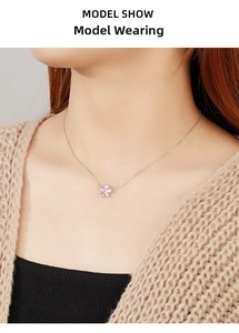 Model wearing a delicate 925 silver necklace with a pink crystal flower pendant and zircons