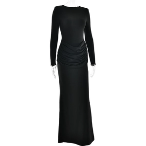 Detail of black long sleeve dress featuring elegant waist ruching and fishtail slit hem