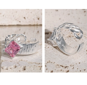 Macro shot of S925 sterling silver ring featuring a pink square zircon and S925 hallmark