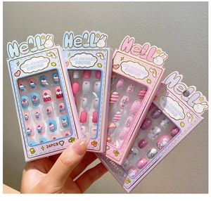 Detail of 24pcs cartoon press-on nail stickers for kids featuring unicorn and star themes