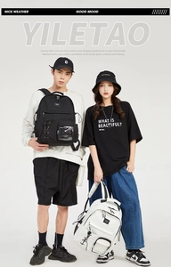 Detail of YILETAO tooling style backpacks with multiple pockets and transparent front slots
