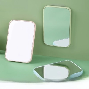Detailed close-up of rectangular minimalist makeup mirrors in various pastel matte colors