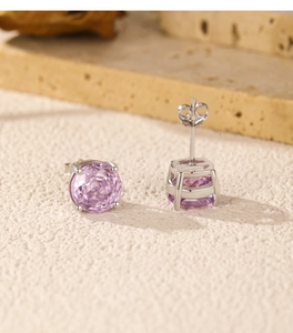 Macro shot of pink rose-cut diamond stud earrings with S925 sterling silver four-claw setting