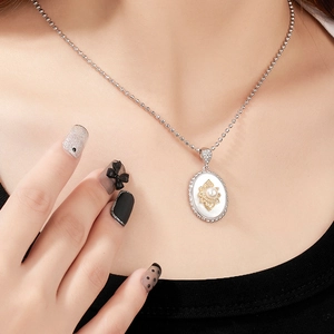 Elegant 925 sterling silver necklace with oval mother of pearl pendant and gold sunburst detail