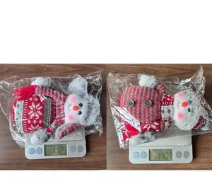 Detailed scale view showing the weight of Christmas snowman plush toys in plastic packaging