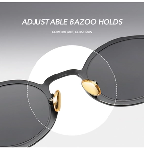Detail view of adjustable golden nose pads on steampunk oval sunglasses for comfort