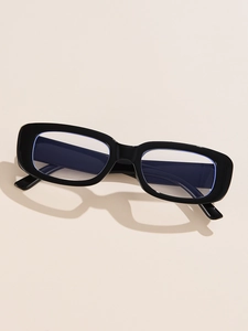 Close-up of retro rectangular black sunglasses with blue light blocking lenses