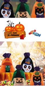 Detail of Halloween drawstring candy bags with cartoon skull and witch designs