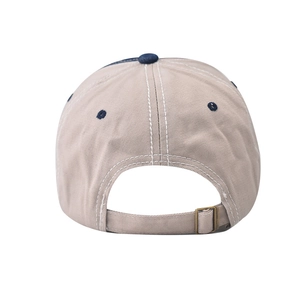 Detail of vintage washed baseball cap featuring metal buckle and contrast stitching