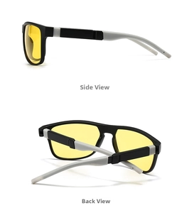 Detalle de gafas de sol deportivas con lentes amarillas de visión nocturna y montura bicolor