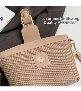 Detail of woven textured leather bag with premium gold magnetic buckle and hardware