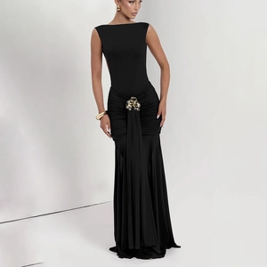 Sultry backless black maxi dress with elegant pleats and gold floral waist detail