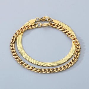 Detail of 18K gold plated layered snake and Cuban chain bracelet set for women and men