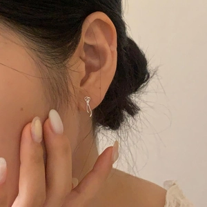 Minimalist S925 sterling silver bow knot stud earrings for women on a model