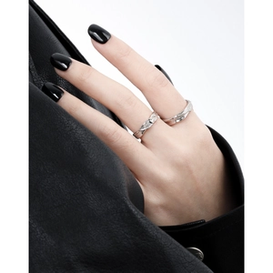 Minimalist silver couple rings featuring textured streamlined design and zircon inlay