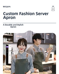 Detail of dark green canvas apron with brown leather straps and metal buckles in a cafe