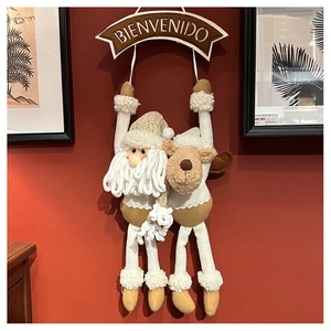 Plush Santa and Reindeer welcome sign with Bienvenido text for Christmas decor
