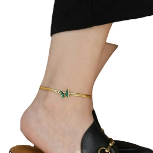 18K gold plated anklet with green butterfly pendant worn by model on white background