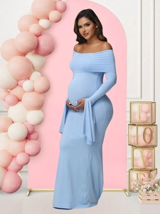 Detail of off-shoulder light blue maternity gown with trumpet sleeves and long train