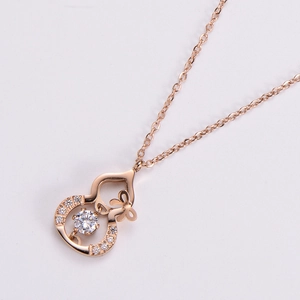Elegant rose gold wulu necklace with sparkling pave diamonds and a dancing center stone