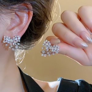 Elegant silver bow earrings with sparkling cubic zirconia and small faux pearls