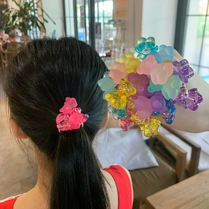 Close-up of colorful resin gummy bear hair ties with frosted and transparent textures