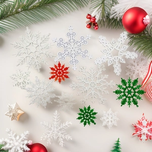 Assorted plastic Christmas snowflake pendants in white red and green holiday decorations