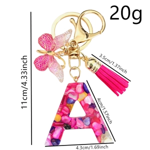 Pink resin letter A keychain with crushed stones, butterfly charm and pink tassel