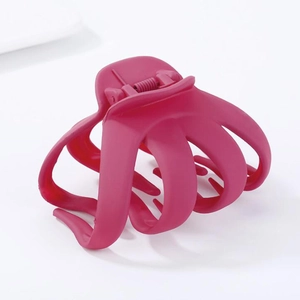 Pink matte octopus hair claw clip with irregular oval geometric design for women