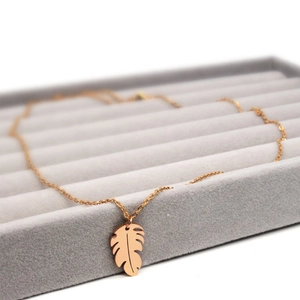 Rose gold stainless steel necklace with hollow leaf pendant in premium jewelry box
