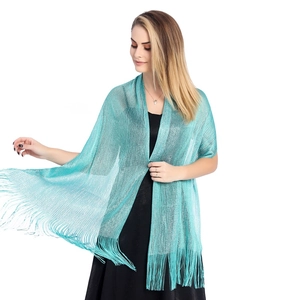 Detail of teal metallic thread shawl with fine fringe edges for bridal party evening wear