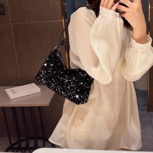 Sparkly black sequin baguette shoulder bag for women with minimalist luxury style