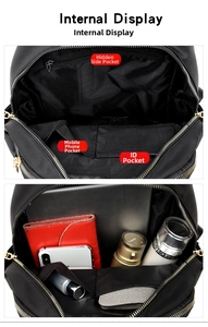 Internal view of large black oxford backpack with multiple organized storage pockets