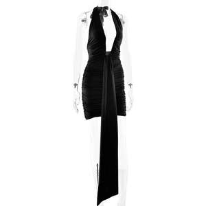 Detail of black halter deep V-neck mini dress with elegant front ribbon and ruched design