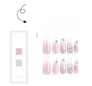 Detail of pink gradient press-on nails with silver butterflies and sparkling rhinestones