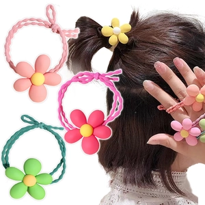 Detail of colorful floral hair ties showing usage on ponytail and wrist for girls