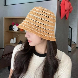 Chic mustard yellow striped straw sun hat for women in a stylish fisherman bucket design