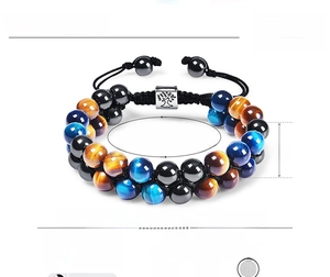 Detail of 8mm tiger eye bead bracelet with tree of life metal charm and size parameters