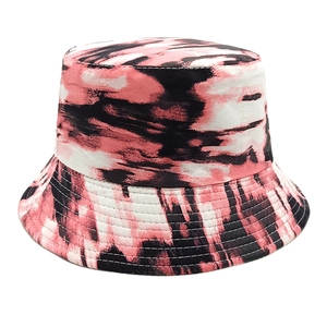 Detailed view of tie-dye bucket hat featuring multi-row brim stitching and abstract print