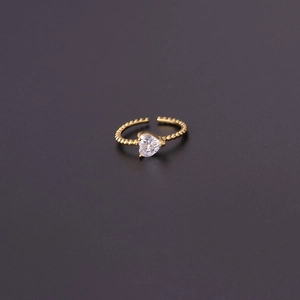 Top view of gold open ring with heart-cut colorful zircon and beaded texture band