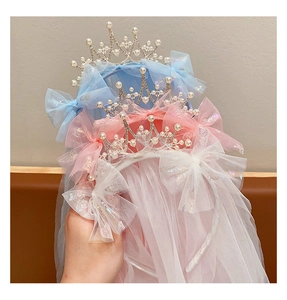 Detailed view of kids princess crown headbands with colorful veils and bowknots