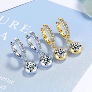 Sparkling zircon hoop earrings with round pendants in silver and gold finishes